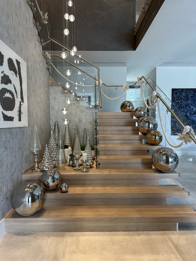Mercury glass spheres and small silver trees stepping up the treads