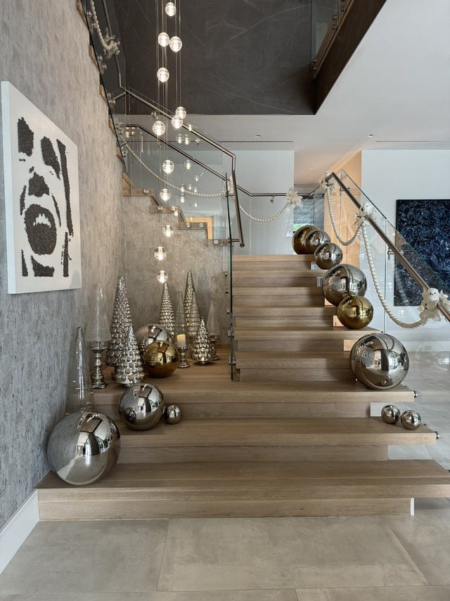 A closer view of the silver trees and spheres along the stair