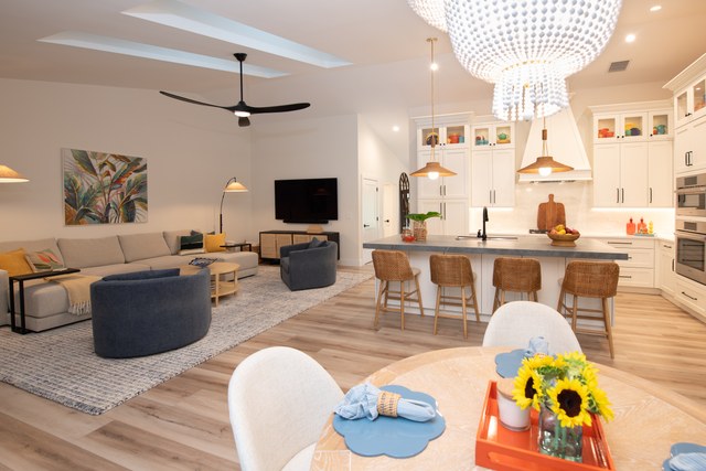 The kitchen and breakfast table with sunflowers on the counter