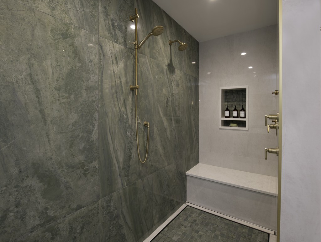 A primary bathroom with a freestanding tub